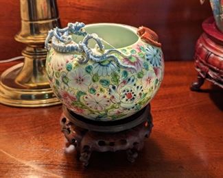 SWEET little Asian porcelain dragon bowl, on wooden stand.