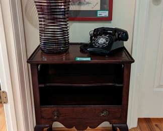 1930's mahogany side table, w/vintage Bell telephone and large art glass vase, "Swirl Girl".