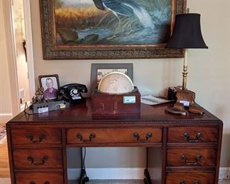 1940's mahogany desk, by Sligh Furniture Co., Holland MI, 1920's The Paget Star Globe, by Henry Hughes & Son, London, brass candlestick table lamp, 1940's Bell telephone, German metal sculpture, antique 3-piece copper desk set, by Jennings Brothers, Bridgeport, CT and vintage composite.