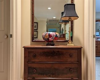Antique 3-drawer mahogany chest, brass candlestick table lamp, amazing Japanese cloisonné bowl, on Wooden stand and vintage fax bamboo wall mirror.