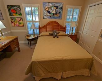 Queen-size pine bedroom suite, by Broyhill, including bed, nightstand, chest and desk. Vintage MCM leather-topped side table, brass candlestick table lamp and collection of contemporary art, by Amy Dandy.