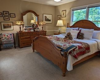 Entire bedroom suite of Pine bedroom furniture, by Lexington, including king size bed, 8-drawer dresser, w/matching mirror and pair of nightstands. Pair of vintage Stiffel brass/glazed ceramic table lamps, set/4 framed matted bird prints, by Arthur Singer and collection of hand-made, vintage cotton quilts.