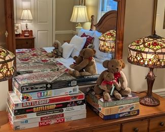 Collection of vintage board games, pair of Tiffany-style stained glass table lamps.
