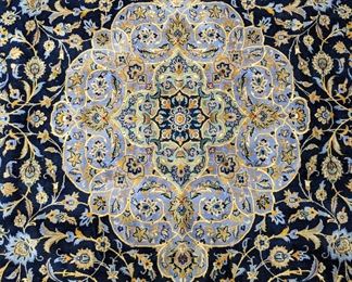 Center medallion of the Persian Kashan rug.