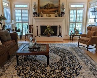 Wonderful, light-filled living room, with heart-stopping Persian Kashan, measuring 9' 10" x 13' 4", pair of wingback chairs, down-filled sofa, by Isenhour Furniture Co. (Taylorsville, NC), pair of inlaid mahogany drop-leaf side tables, by Hekman Furniture Co. (Grand Rapids, MI), pair of large cast iron andirons, reportedly from the Swan House, pair of 23" tall L-R facing Asian Porcelain urns, on wooden stands, w/marble inserts, antique oil painting, by listed English artist, W. G. Meadows, pair of important 12" tall butter yellow Asian cloisonne urns, on wooden stands, 1940's mahogany corner table and vintage mahogany coffee table, w/brass top.