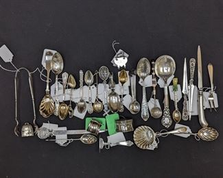 Sweet assortment of sterling silver souvenir spoons, ice tongs and fluted servers.