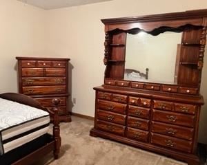 Queen bedroom set, including bed, large dresser, and highboy dresser. 