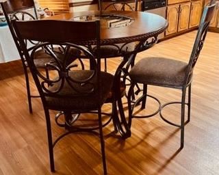 Kitchen/Dining table, bar style,with 4 chairs. 45"H  x 37" Dia