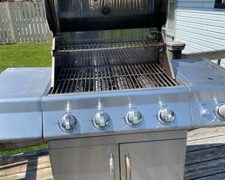 Master Forge outdoor gas grill with side burner. Propane tanks with electric start. Retails for $1500