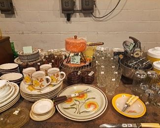 Unopened vintage fondue pot, vintage 1970's plates, mugs and bowls, glassware sets. 