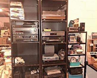 Miscellaneous audio electronics, including Pioneer turntable, VHS and tap players, headphones, speakers, casette holders. 