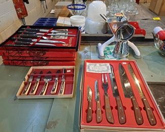 Unused knife sets still in boxes. 