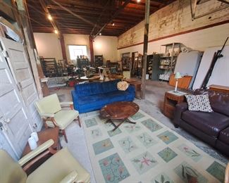 Butlers table, leatherette settee, many battery operated candles, lovely handmade carpet,  antique doors for sale. 