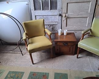 Mid century pleather armchairs, wood holder, three large skylights, antique small end table with drawer. 