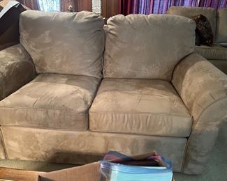 One of a pair of tan colored live seats Like New