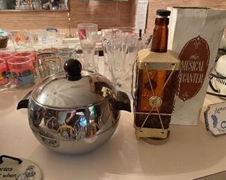 Chrome penguin ice bucket and musical whiskey decanter 