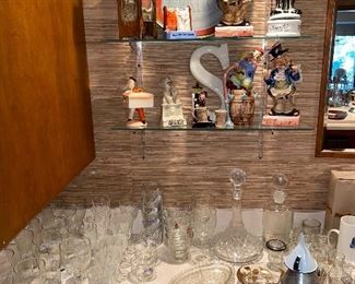 Lots of glass barware and musical hobo decor 