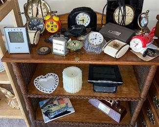 Wicker and wood table full of home collectibles 