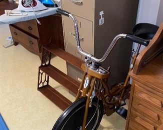 Exercise bike, file cabinet, wall mounted shelf 