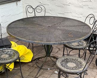 Wrought iron table and 6 chairs