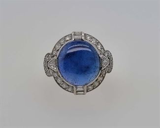 Very good condition. From Calhoun's: "One lady's 90% platinum 10% iridium "Tiffany & Co." ring containing the following stones: A) One oval cabochon blue sapphire measuring 12x11mm and weighing approximately 4.8cts. B) Twenty-eight round brilliant-cut diamonds measuring 1.7mm each and weighing approximately .02cts each with a color of F and clarity of VVS1. C) Eight straight baguette-faceted diamonds measuring 2.5x1.5mm each and weighing approximately .03cts each with a color of F and clarity of VVS1. D) Six square French-faceted diamonds measuring 2.0mm each and weighing approximately .05cts each with a color of F and clarity of VVS1. E) Two triangle-shaped diamonds with flat corners measuring 2.75mm each and weighing approximately .05cts each with a color of F and clarity of VVS1. Finger size: 5 1/4. Metal  weight: 4.0 TWTs." Appraised for $9,800.00 in 1994 by a local jeweler, copy included with purchase. From appraisal: "One ladies ring, marked Plat./10% Irid, set with one 12.50 x 1
