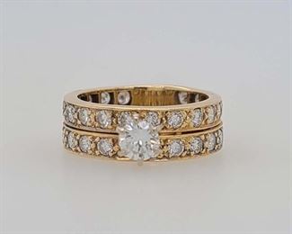 Very good condition. From Calhoun's: "One lady's yellow gold wedding set containing the following stones: A) One round brilliant-cut diamond measuring 4.9mm and weighing approximately .46cts with a color of J and clarity of VS1. B) A combined (in both the engagement ring and wedding ring) total of 38 round brilliant-cut diamonds measuring 2.7mm each and weighing approximately .07cts each with a color of G and clarity of SI1. Note: The wedding set is soldered together. Finger size: 8. Metal weight: 5.31 DWTS." Appraised for $9,350.00 in 2007 by a local jeweler, copy included with purchase. From appraisal: "Two ladies yellow gold 3.62m/m wide anniversary rings, one not karat or trademarked, estimated to be 14K, the other is marked 14K, trademarked FH. Both are set with twenty round brilliant cut .05 carat diamonds with total weight of 2.00 carats. Diamonds that are set in the first anniversary ring are a grade 2. The diamonds set into the trademarked FH are a grade 1. Set in between the 