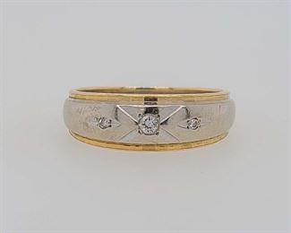 Very good condition. From Calhoun's: "One men's 14kt (stamped "Famor") yellow/white gold wedding band containing the following stones: A) One round brilliant-cut diamond measuring 2.75mm and weighing approximately .08cts. B) Two round brilliant-cut diamonds measuring 1.7mm and weighing .02cts each. Finger size: 9. Metal weight: 3.32 DWTs." Appraised for $450.00 in 1994 by a local jeweler, copy included with purchase. From appraisal: "One gents white with yellow trim 6.92 tapering to 3.7m/m wedding band, marked 14K, trademarked FAMOR, sets with one .05 carat round brilliant cut diamond and two .02 carat round single cut diamonds. All grade 2."

