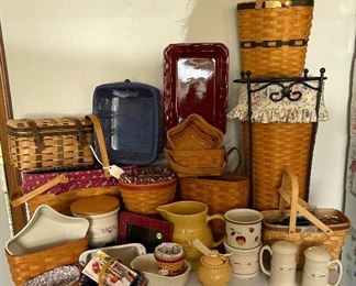 Longaberger baskets & pottery with wrought iron umbrella stand. 
