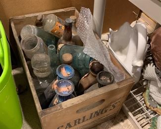Vintage advertising crate and antique bottles
