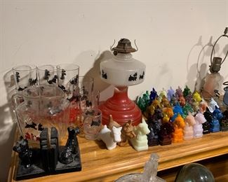 Scotch terrier pitcher, glasses, oil lamp, book ends, and figurines