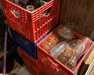 Crates upon crates of antique bottles, milk bottles, beer bottles, etc