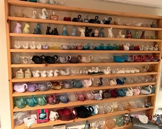Wide selection of antique carnival glass swans and dogs