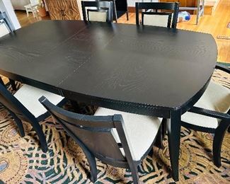 Beautiful black dining table and  six chairs with linen-style seats and backs: With 18" removable leaf 90" long x 44" wide x 30" tall. This item is available for pre-sale purchase. 