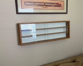 Train display case and locomotive picture