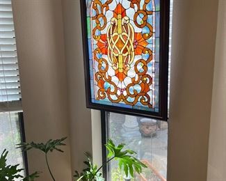 A pair of stained glass and plants