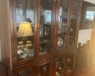 Asian Two section curio cabinet with crystal and misc pieces