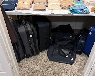 Luggage on rollers and linens