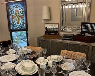 Arched mirror and silver mirrored buffet