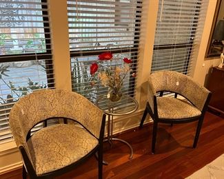 Pair of exotic print chairs and a pair of silver and glass table