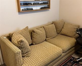 Sleeper sofa and colorful rug