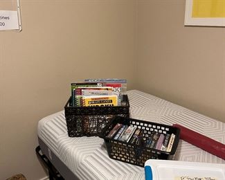 Folding Twin bed and books