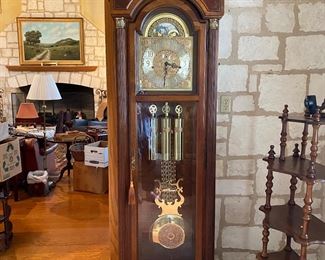 Howard Miller grandfather clock in working order. 