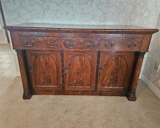 
3.  $350.00. Projection front server with  detached columns which is dated to C 1840.  Embellished with cast bronze ormolu.  Burled walnut veneer.  Bail pull handles. 36" x 60 x 24" 