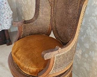 8.  $200.00. Bergere Sheraton style antique chair. C 1870.  Cane sides and seat w/o any damage.  Hand carved accents.  So pretty.  45" x 36" x 24" 