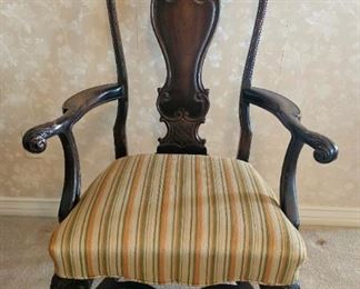 16.  $200.00 .  Fraternal/smoking chair.  Rococo style.  Restoration to backside of chair splat.  Walnut.   49" x 29" x 25" 