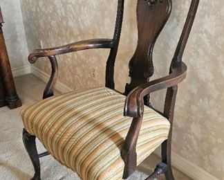 20.  $200.00.  Fraternal/gents smoking chair.  Carved crest rail. 50" x 29" x 24" 