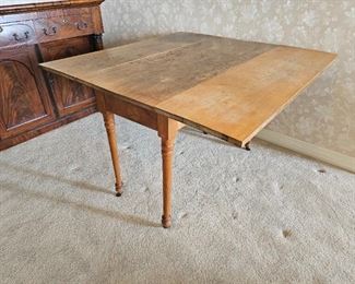 22.  $125.00. Tea table drop leaf table 28" x 41" extended  x 18" leaves down, x 42" 