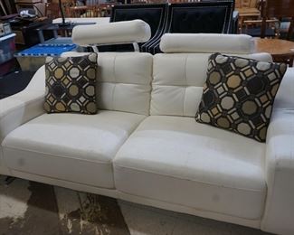 WHITE COUCH WITH ADJUSTABLE HEAD RESTS