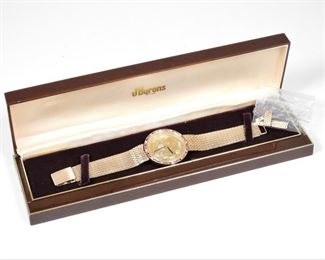 40: Corum 14K Gold Dollar & Gemstone Watch