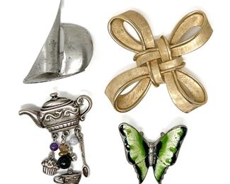 Four Costume Brooches: Trifari Bow, Sterling Sailboat, Enameled Butterfly, Silver-Tone Teapot